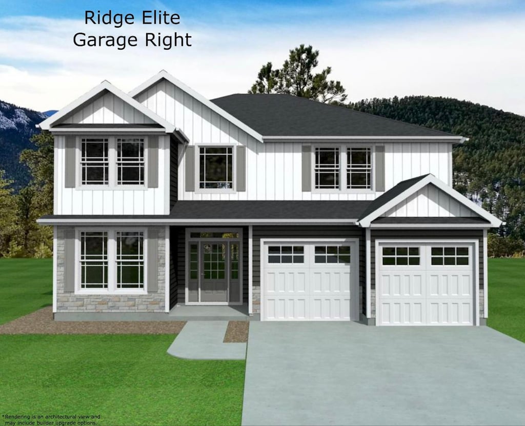 view of front of house with a garage, a mountain view, and a front yard