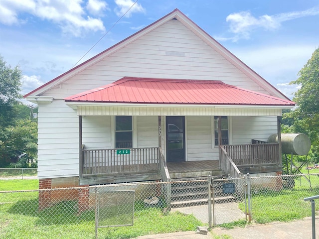 bungalow-style house featuring a porch and a front yard