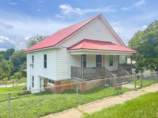 view of front of property with a front yard and covered porch