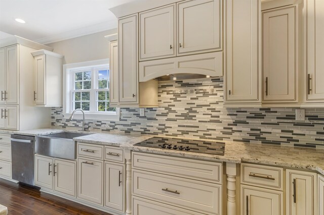 kitchen featuring sink, tasteful backsplash, stainless steel dishwasher, black electric stovetop, and light stone countertops