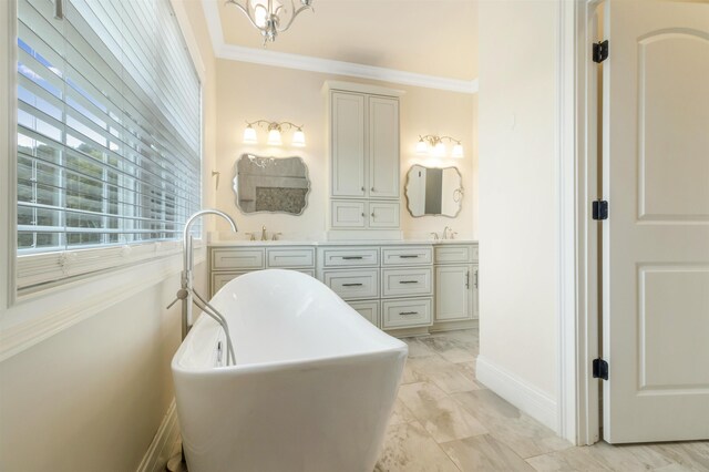 bathroom featuring crown molding, vanity, and a washtub