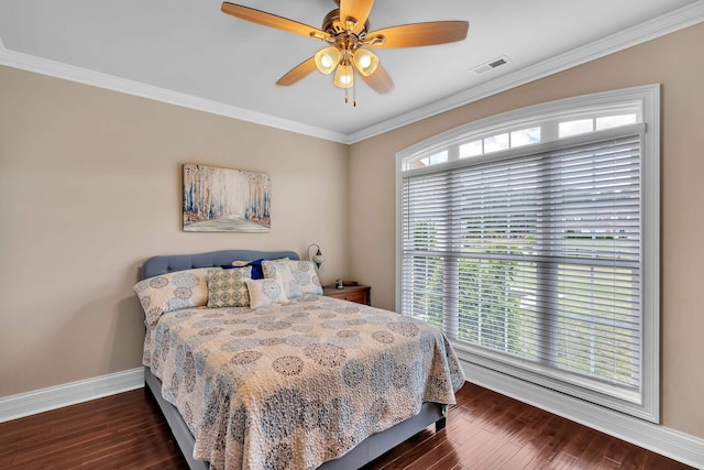 bedroom with dark wood-type flooring, ceiling fan, and ornamental molding