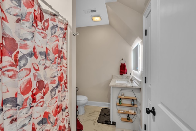 bathroom featuring vanity, toilet, and a shower with shower curtain