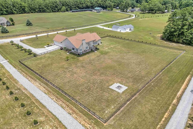 birds eye view of property with a rural view