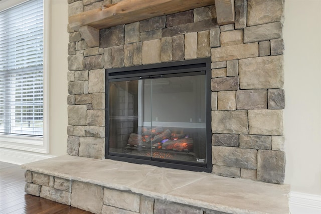 room details featuring hardwood / wood-style flooring and a fireplace