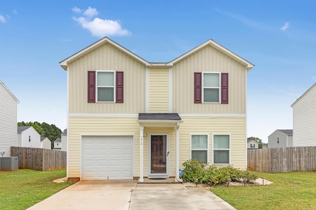 view of front of home with a front yard, central air condition unit, and a garage