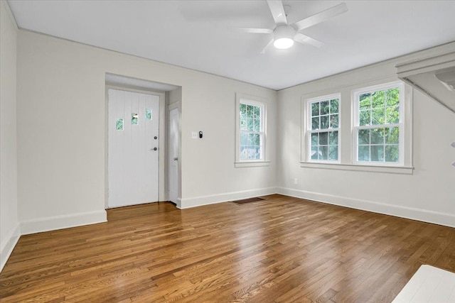 unfurnished room featuring ceiling fan and hardwood / wood-style flooring