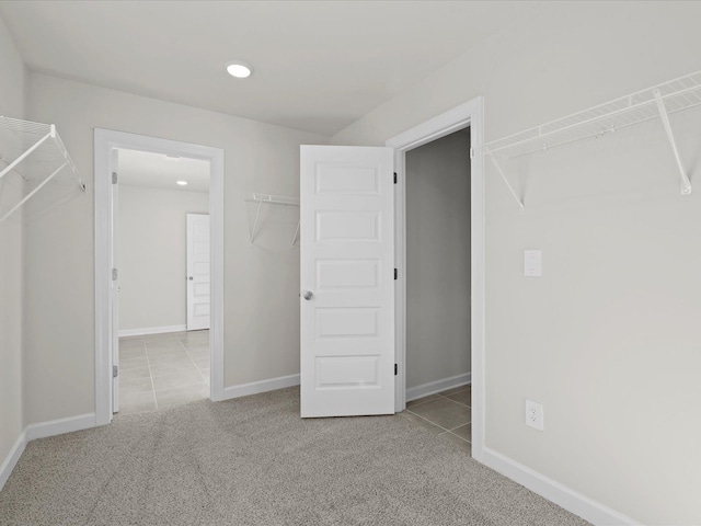 walk in closet featuring light tile patterned floors