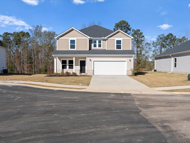 view of front facade featuring a garage and a front yard