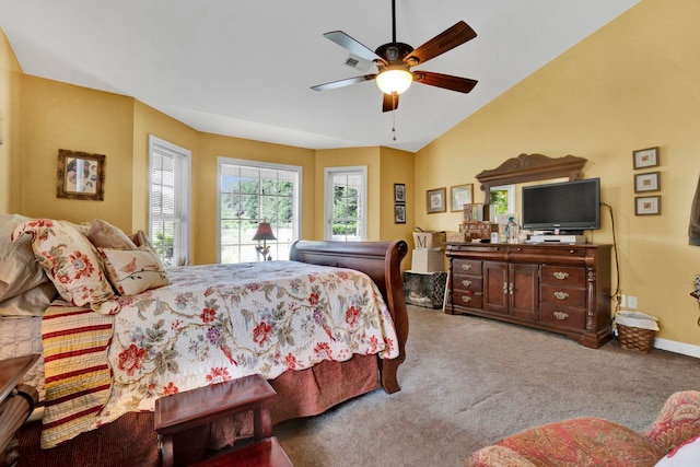 carpeted bedroom with ceiling fan and lofted ceiling