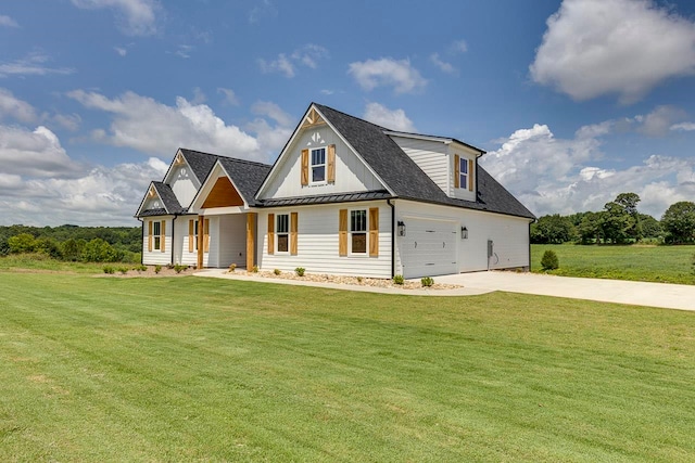 view of front of home with a garage and a front yard