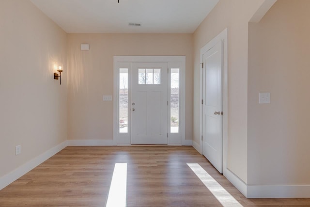 entrance foyer with light hardwood / wood-style flooring