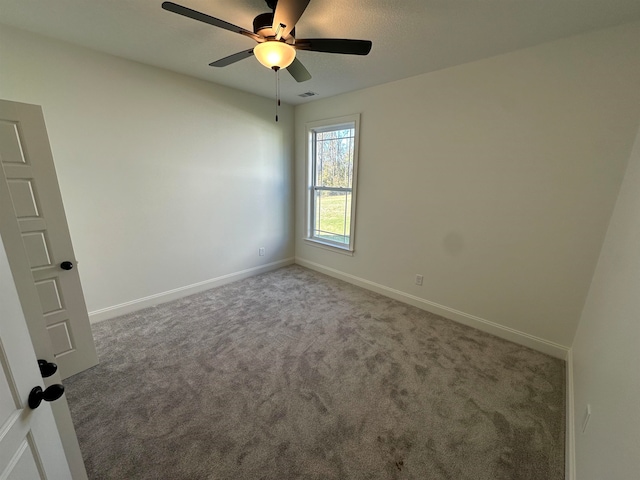 unfurnished room featuring carpet floors and ceiling fan