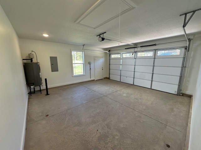 garage with a garage door opener, electric panel, and water heater