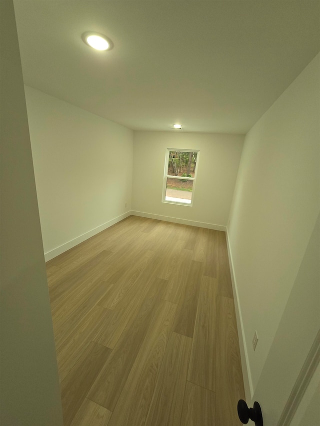 spare room featuring light wood-type flooring