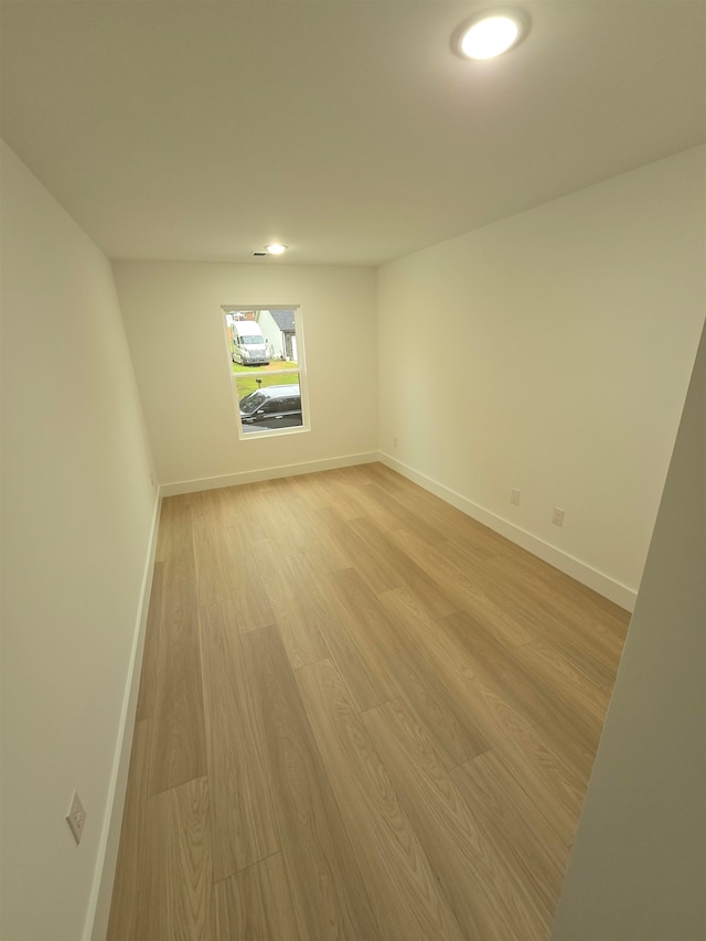 spare room featuring light hardwood / wood-style flooring