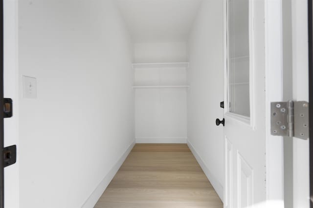 spacious closet featuring light wood-type flooring