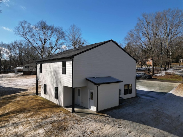 rear view of property featuring a patio area