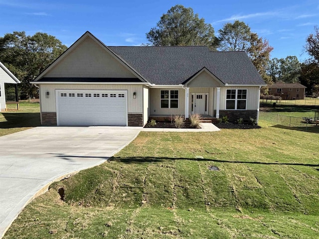 single story home featuring a garage and a front yard