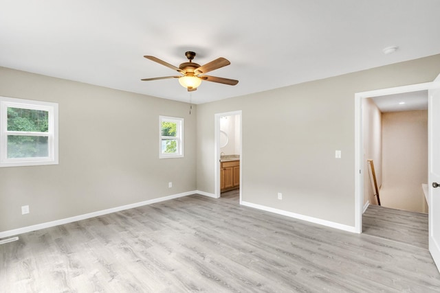 spare room featuring light hardwood / wood-style floors and ceiling fan