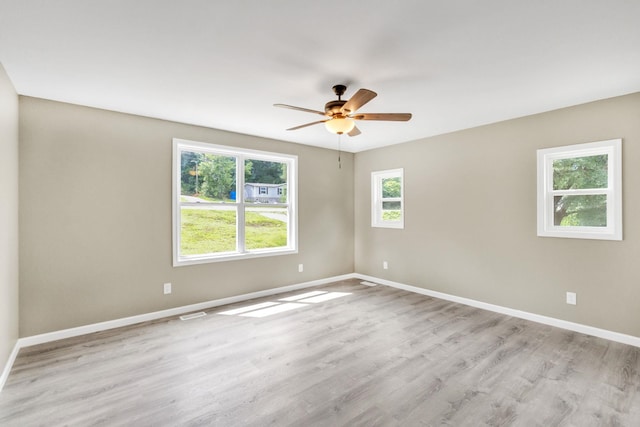 unfurnished room featuring ceiling fan and light wood-type flooring