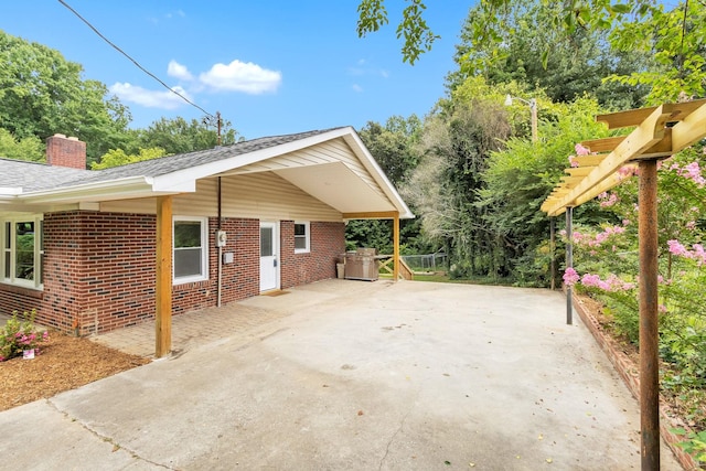 view of property exterior with a patio