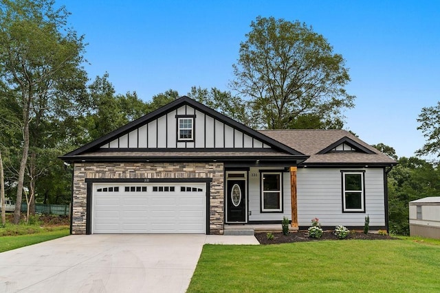 view of front of property with concrete driveway, board and batten siding, a garage, stone siding, and a front lawn