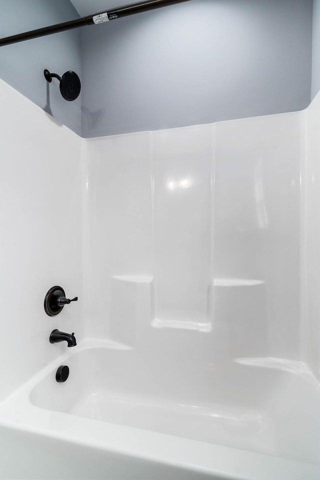 full bathroom with washtub / shower combination