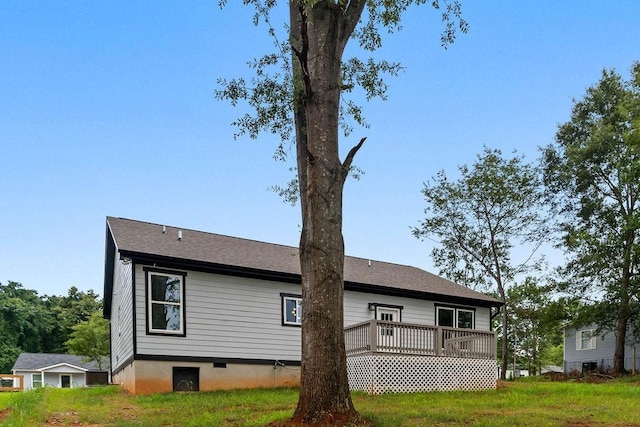 rear view of house with a wooden deck