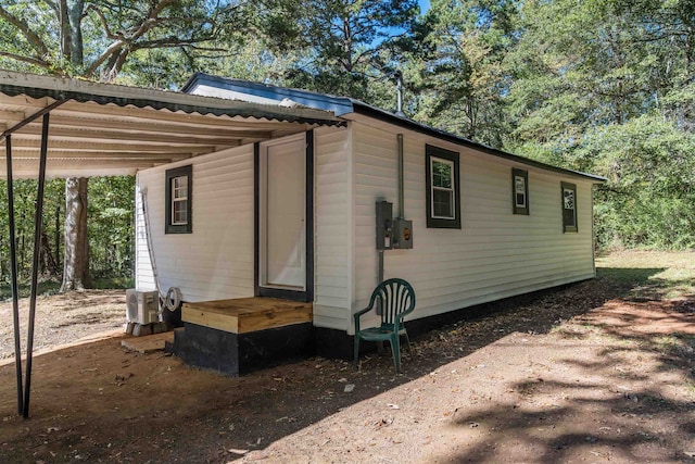 view of outbuilding featuring a carport