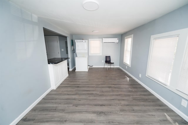 hallway featuring hardwood / wood-style floors and a wall mounted air conditioner