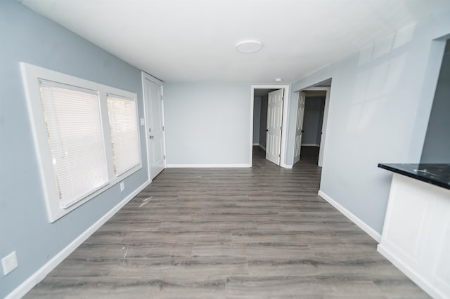 spare room featuring wood-type flooring