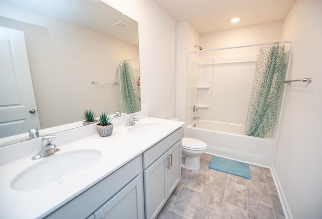 full bathroom featuring shower / tub combo, vanity, and toilet