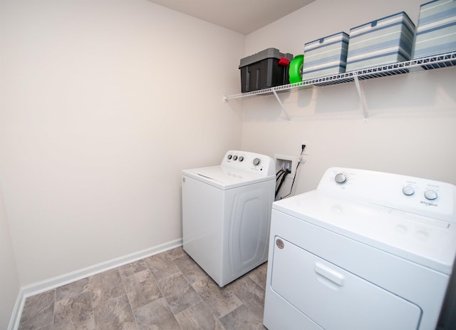 washroom featuring washing machine and dryer