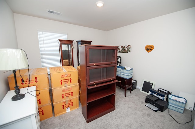 office space with light colored carpet