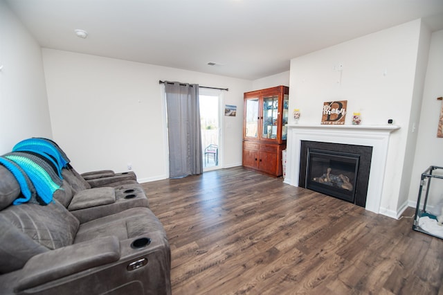 living room with dark hardwood / wood-style floors