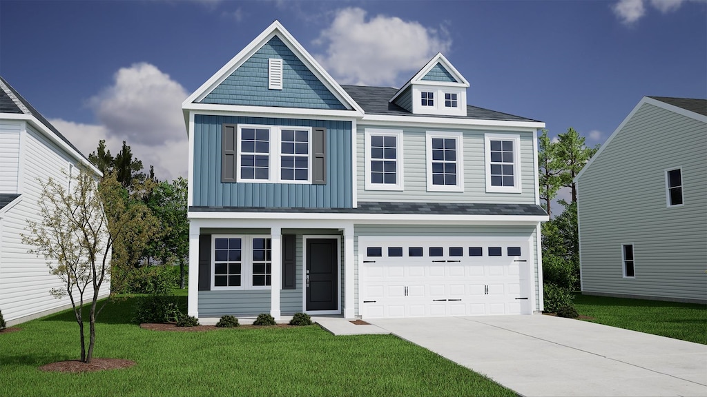 view of front of house featuring a front lawn and a garage