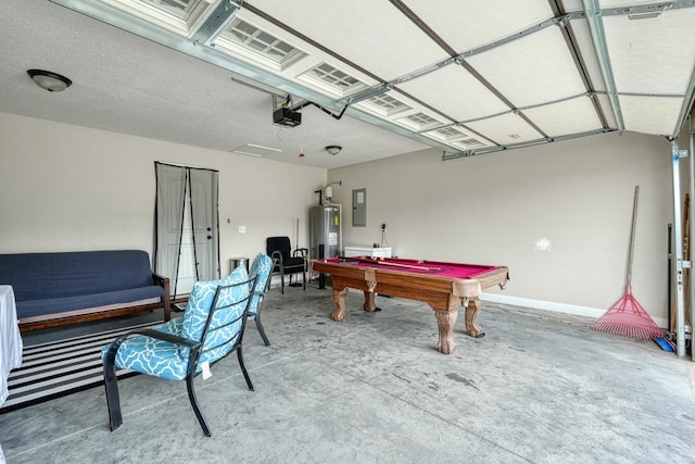 game room with water heater, concrete flooring, electric panel, and billiards