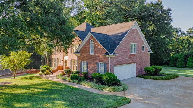 view of front facade with a garage and a front yard