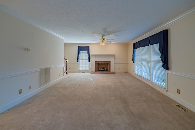 unfurnished living room with light colored carpet, ornamental molding, and a brick fireplace