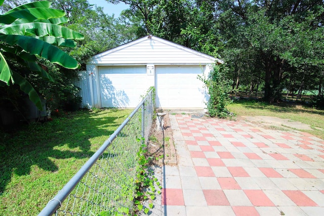 garage featuring a yard