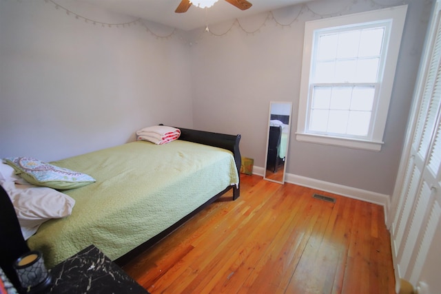 bedroom featuring hardwood / wood-style floors and ceiling fan