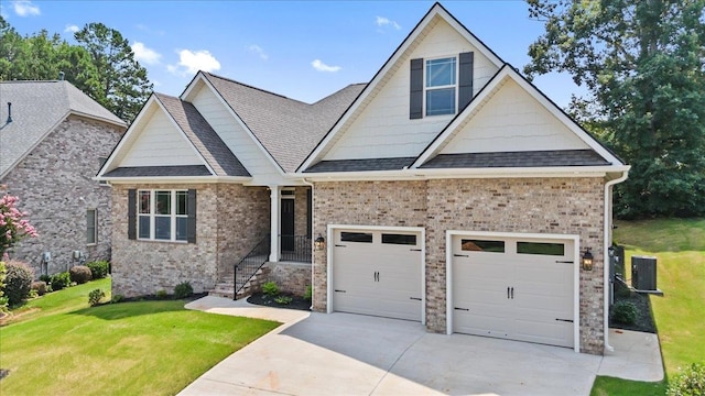 craftsman house with a front lawn and central air condition unit