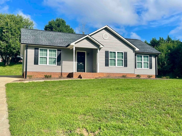 single story home with a front yard