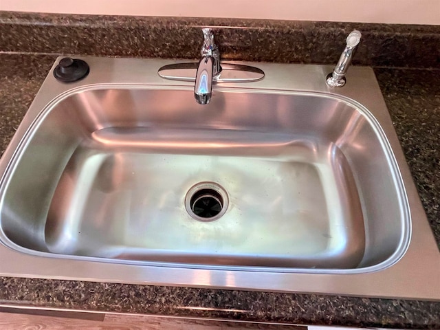 room details with dark stone counters and sink