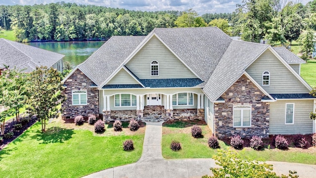 craftsman-style home with a front yard