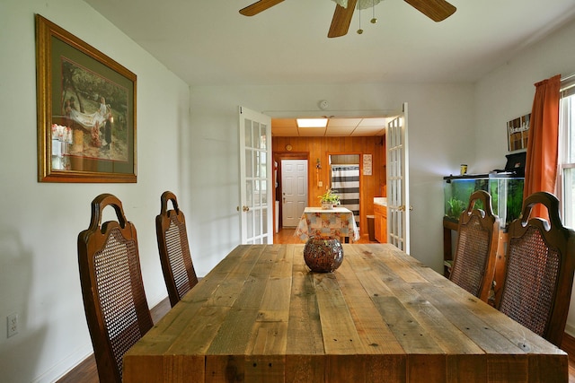 dining area with french doors, baseboards, and ceiling fan