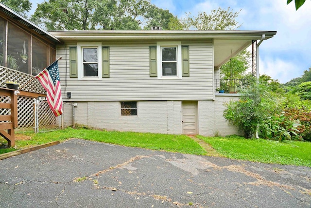 view of home's exterior featuring a sunroom