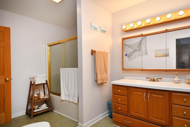 bathroom featuring shower / bath combination with glass door, vanity, and tile patterned floors