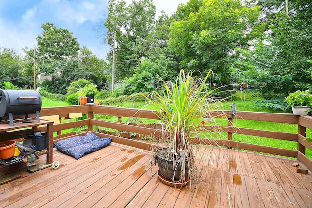 wooden deck featuring area for grilling